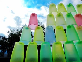 Low angle view of multi colored umbrellas against sky