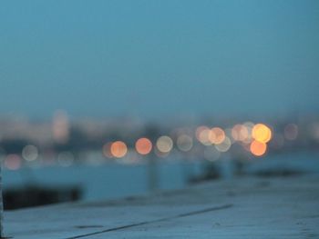 Defocused image of illuminated city at night