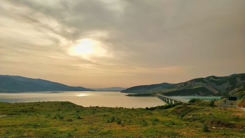 Scenic view of lake against sky during sunset