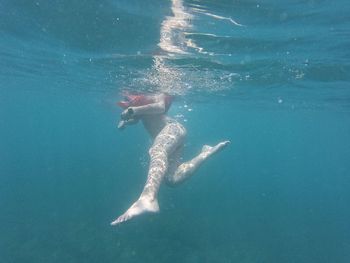 Low angle view of person swimming in sea