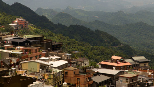 High angle view of townscape and mountains