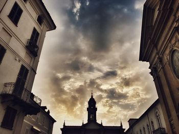 Low angle view of statue in city against sky