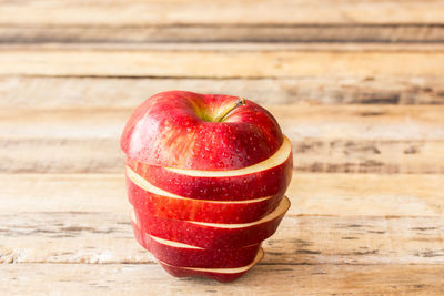 Close-up of red apple on table