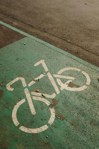 High angle view of bicycle sign on road