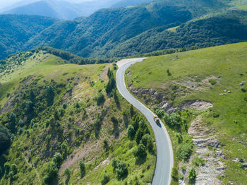 High angle view of road amidst mountains