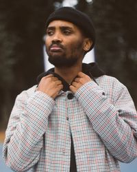 Portrait of young man looking away