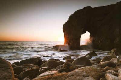 Scenic view of sea against clear sky during sunset