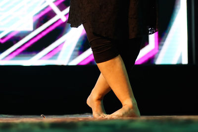 Low section of woman standing on floor