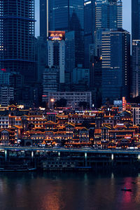 Illuminated modern buildings in city at night