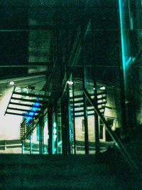Illuminated staircase of building at night