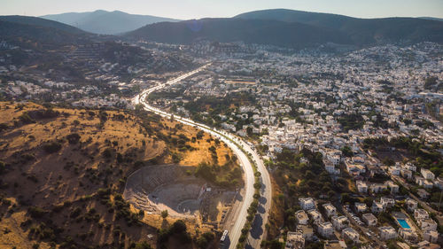 Sunset at bodrum, turkey, with a view along the winding road among the city down trough mountains