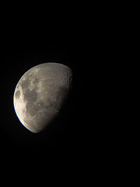 Close-up of moon over black background