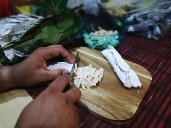 High angle view of person preparing food on table