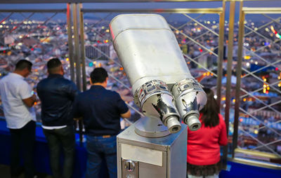 Rear view of people standing at amusement park