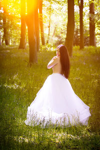 Rear view of woman standing in park