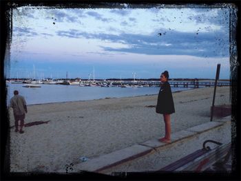 Woman standing on beach