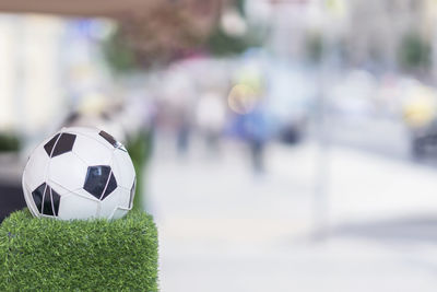 Close-up of soccer ball on grass