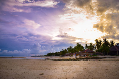 Scenic view of beach against sky during sunset