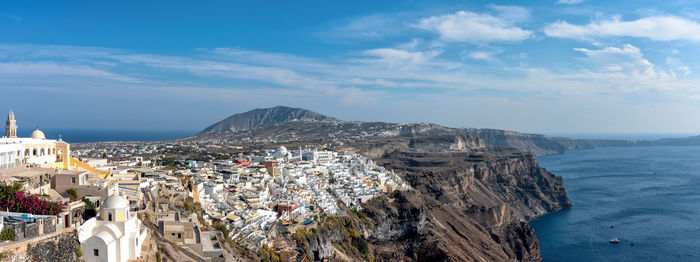 Aerial view of city by sea