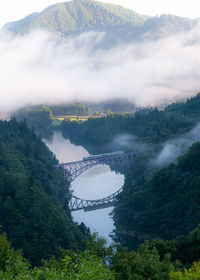 High angle view of bridge over mountains against sky
