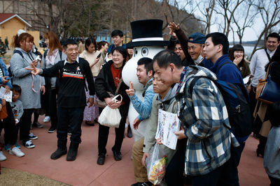 Group of people standing against the wall