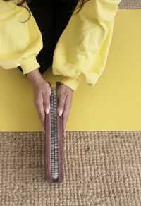 Cropped hand of man holding equipment