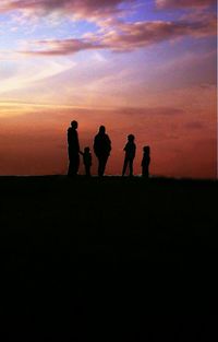 Silhouette of people at sunset