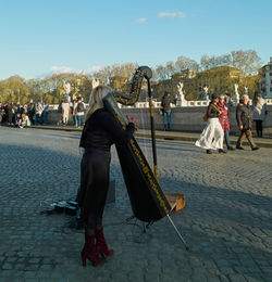 People walking on street in city