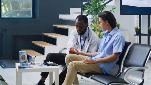 Doctor examining patient in office