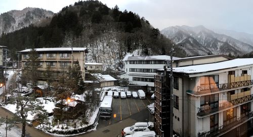 High angle view of buildings in city during winter