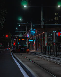 Train at railroad station at night tram sydney 