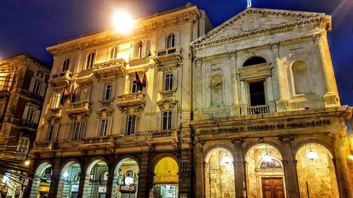 Low angle view of historical building at night