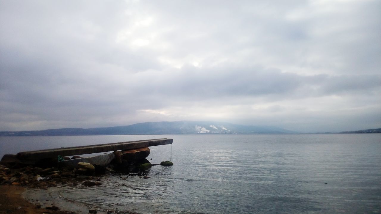 water, sky, sea, tranquil scene, tranquility, scenics, cloud - sky, beauty in nature, cloudy, horizon over water, nature, weather, overcast, cloud, idyllic, calm, waterfront, nautical vessel, outdoors, no people