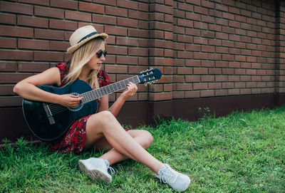 Young woman playing guitar