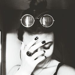 Portrait of young woman wearing sunglasses
