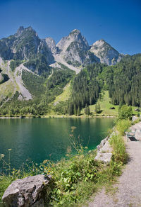 Scenic view of lake and mountains against sky