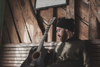 Portrait of man playing guitar