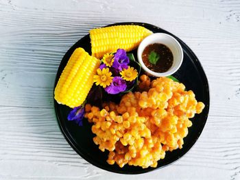 High angle view of various flowers in bowl on table