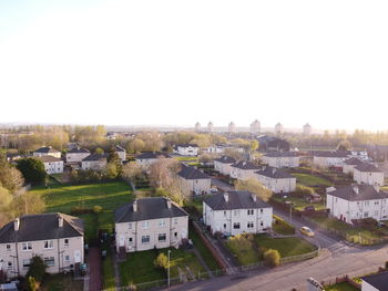 High angle view of buildings against clear sky