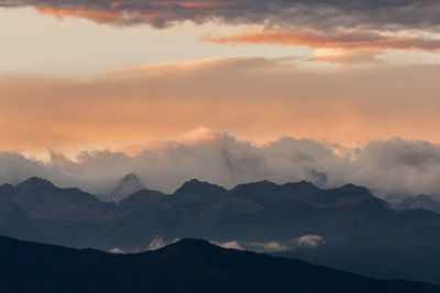 Scenic view of mountains against sky during sunset