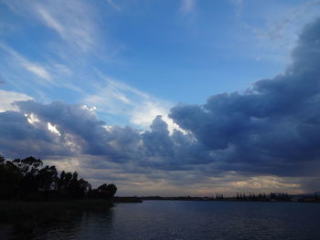 Scenic view of sea against cloudy sky