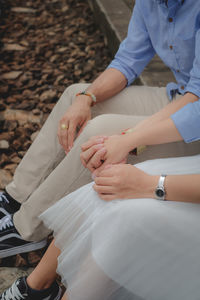 High angle view of people holding hands