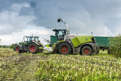 Tractor on field against sky