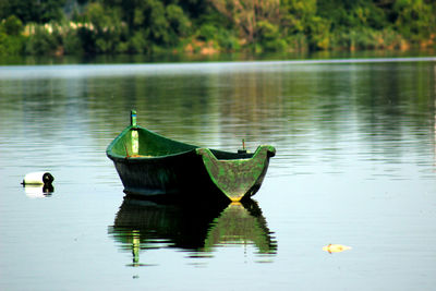 Boat floating on lake