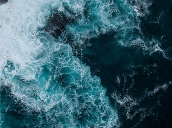 High angle view of waves splashing in sea