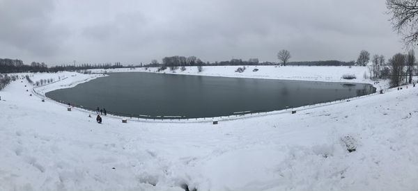 Scenic view of frozen lake against sky