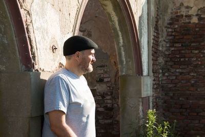 Outdoors portrait of man wearing flat cap