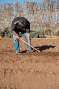 Man working in mud