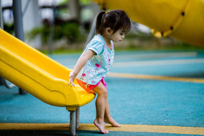 Girl playing in swimming pool