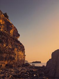 Scenic view of sea against clear sky during sunset